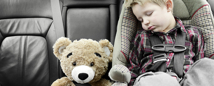 child buckled into car seat