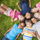 children laying down on the ground