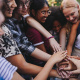 group with hands in the center