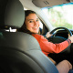 teen looking back from the driver seat