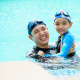 father and son in pool