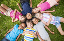 children laying down on the ground