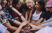 group with hands in the center